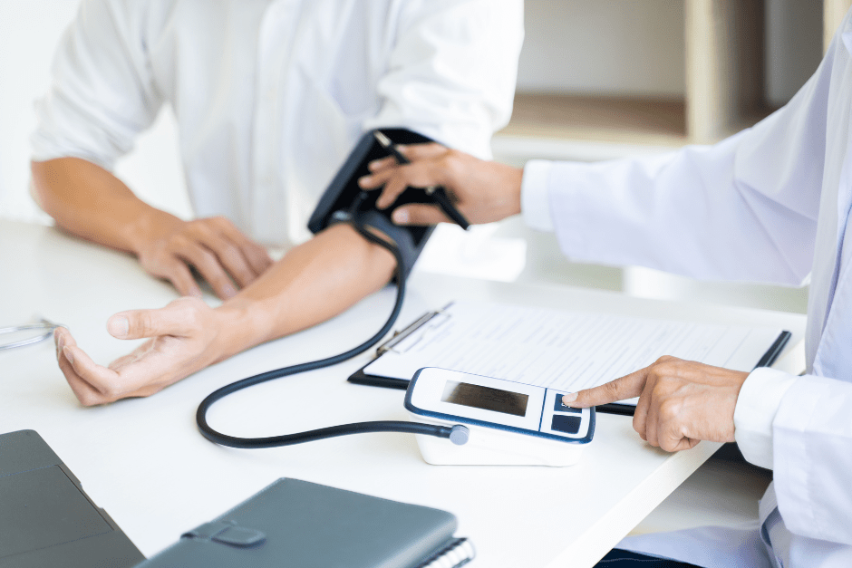 a doctor taking a patient's blood pressure